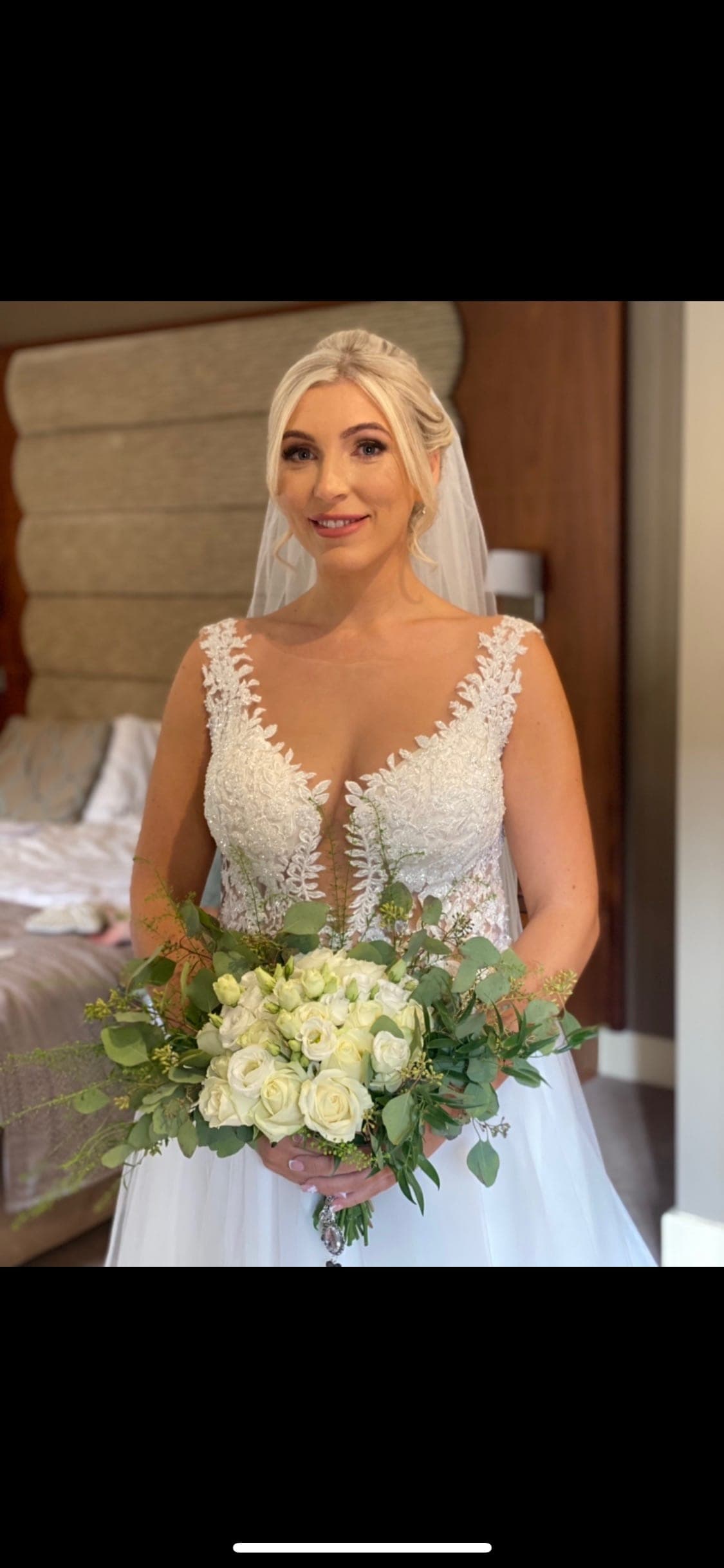 Bride with veil and white roses, makeup by Tallulah